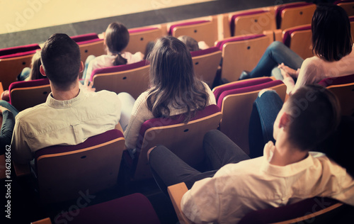 Adult audience expecting movie to begin