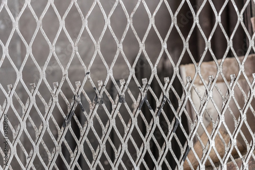 Metal mesh texture gray with black background. © LUISVILLEDA