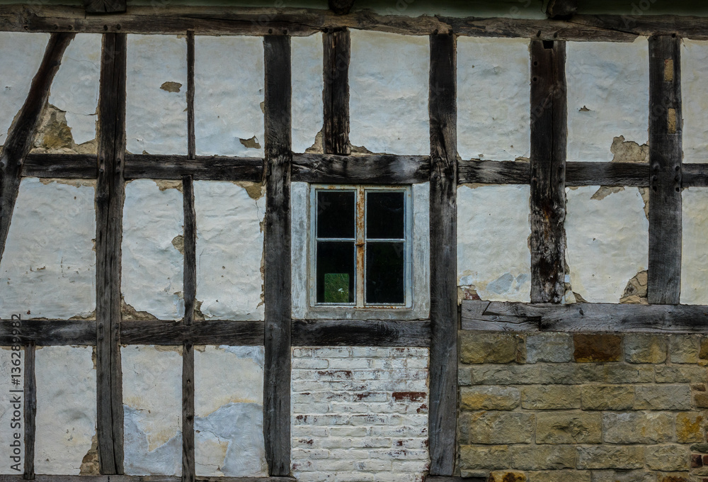 The wall and window of an old farmhouse
