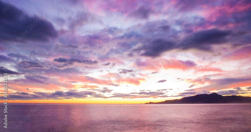 cloud,purple sunset on the sea with Portofino mount in the back