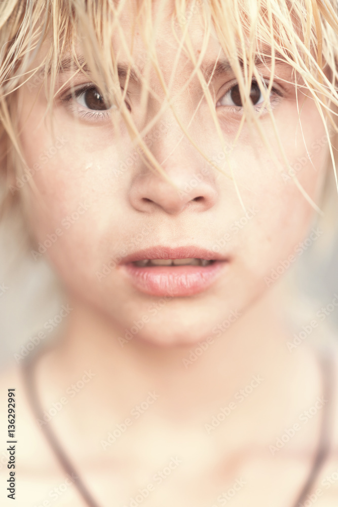 Face of girl blonde teenager. Toned Face of girl blonde teenager. Toned
