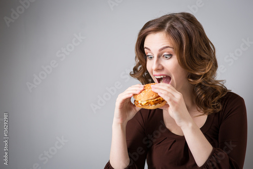 Young woman with hamburger