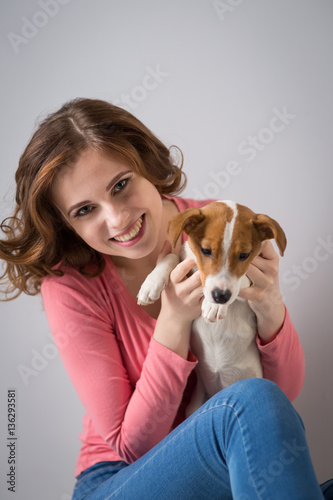 young woman with a puppy Jack Russell