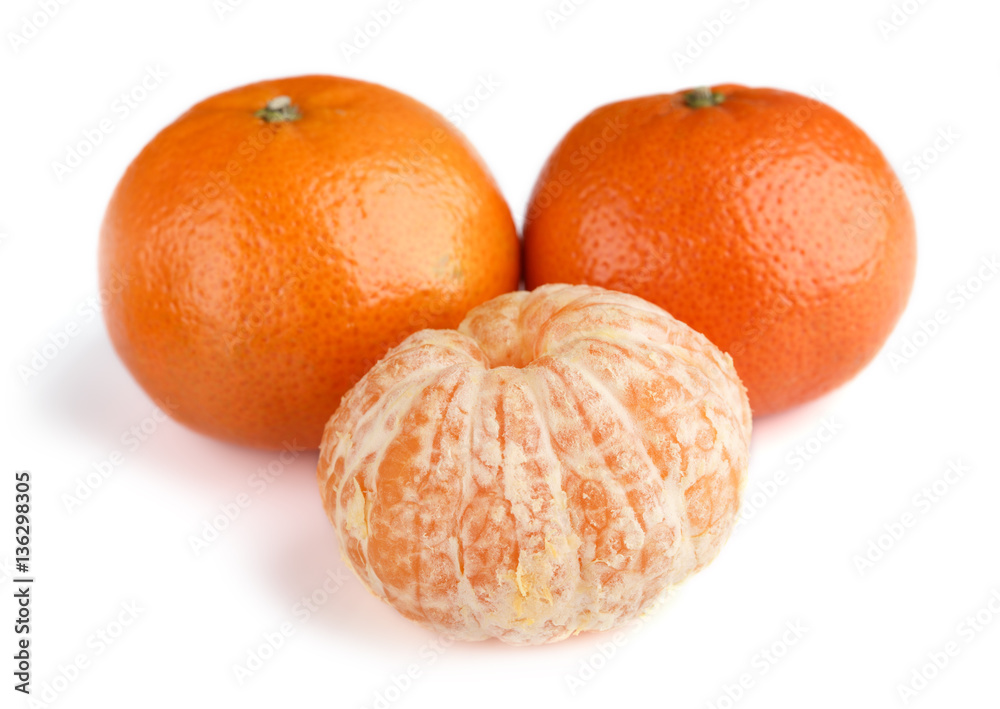 Ripe mandarin close-up on a white background. Tangerine orange. Colorful Food and drink still life concept. Fresh fruits and vegetables on color background. Clementine. Citrus. Fresh fruits. Diet. Ripe mandarin close-up on a white background. Tangerine orange. Colorful Food and drink still life concept. Fresh fruits and vegetables on color background. Clementine. Citrus. Fresh fruits. Diet.