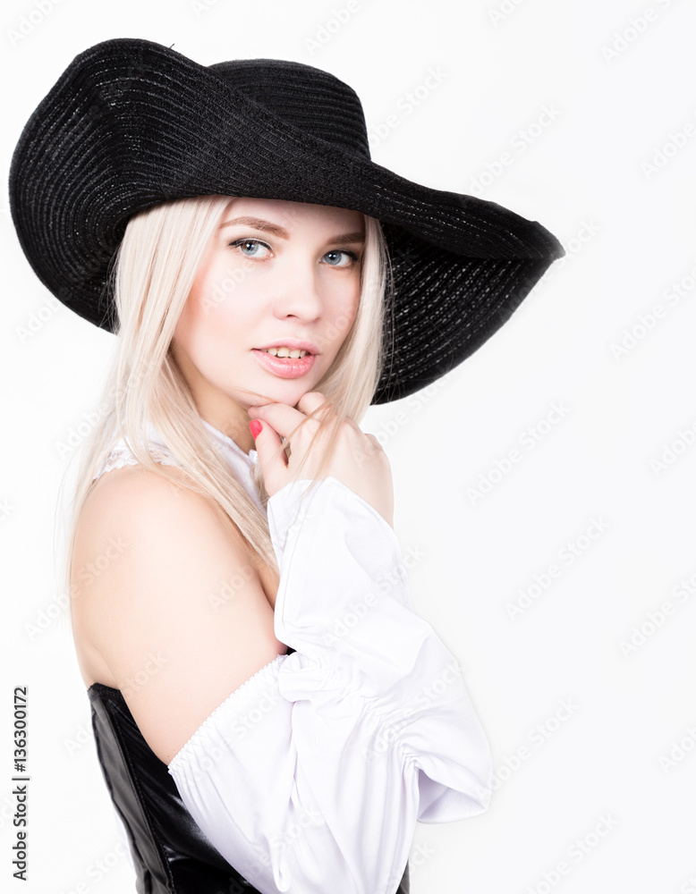 sexy woman with hourglass figure dressed in black leather corset with wide-brimmed hat sexy woman with hourglass figure dressed in black leather corset with wide-brimmed hat