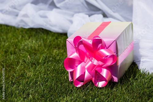 several gift packings lie on a green lawn.