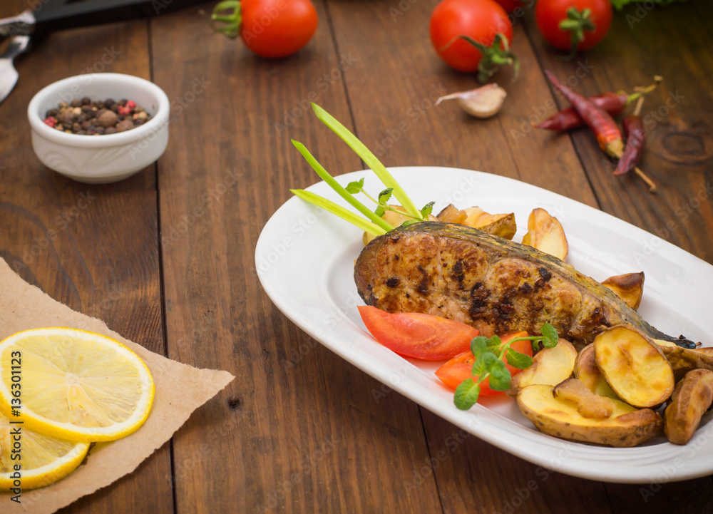 Deep Fried Dolly Fish Steak with French fries on wood background. Top view. Close-up