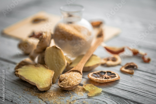 still life of fresh ginger with a wooden spoon sugar © puhimec