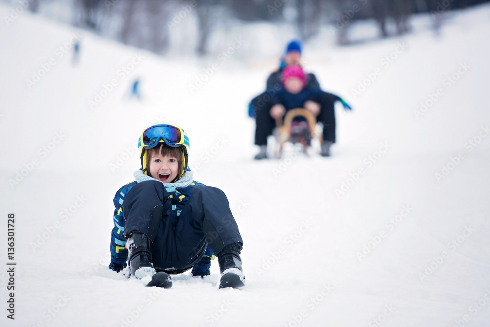 Cute child, skiing in the mountain