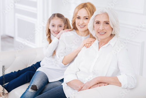 Pleasant senior woman resting with her family