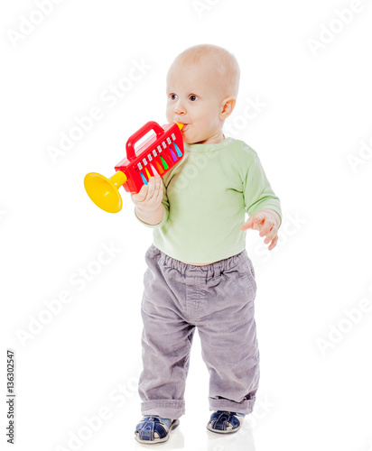 baby playing pipe