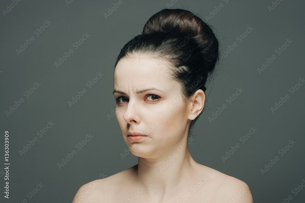 the woman turned her head to the side, a stern gaze the woman turned her head to the side, a stern gaze