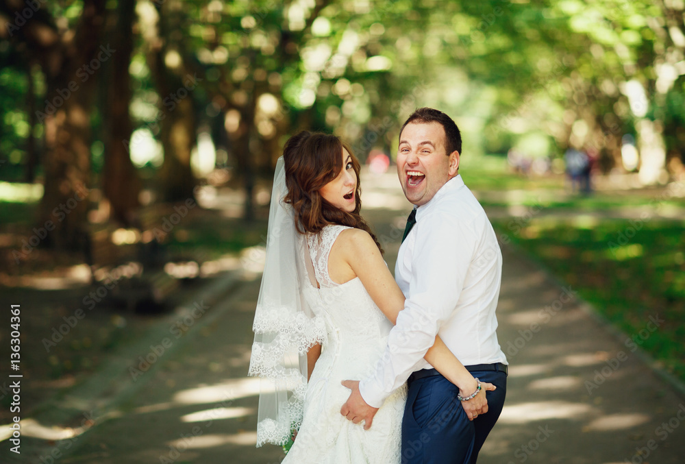 The lovely couple in love walking along the park