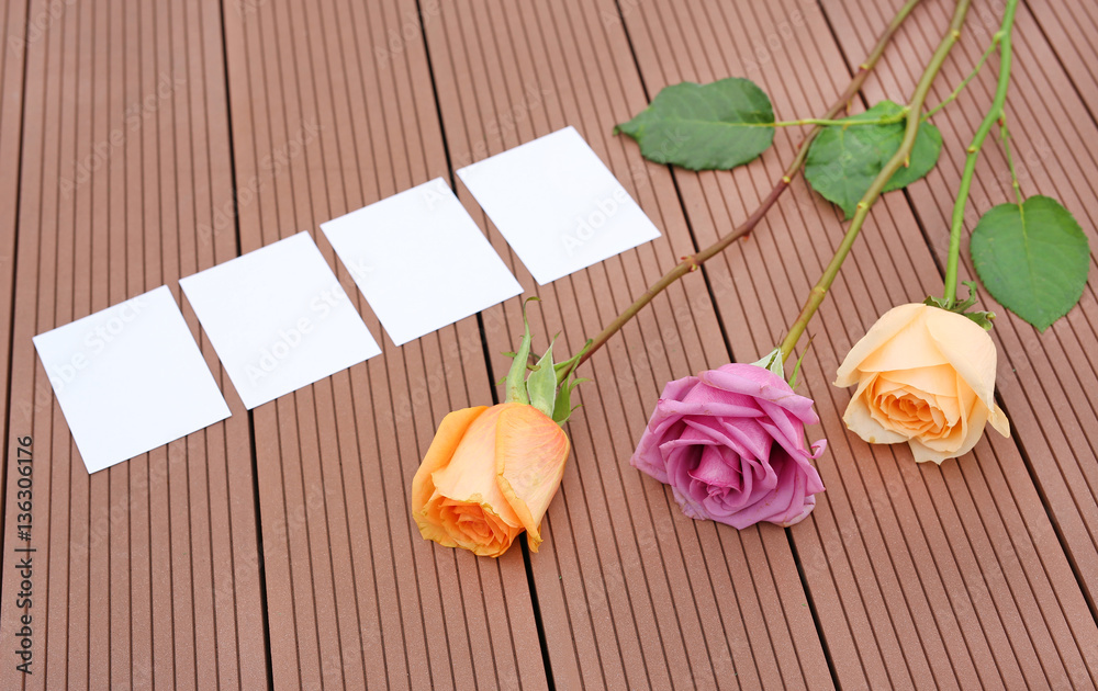 Empty notepaper with pink rose flower on wooden. Empty notepaper with pink rose flower on wooden.