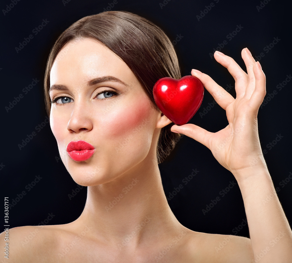 Beauty Young model Girl with Valentine Heart in her hand. Love C Beauty Young model Girl with Valentine Heart in her hand. Love C