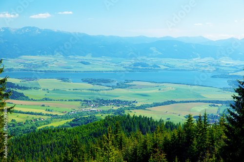 Beautiful landscape  forest and meadow and lake with mountain in background. Slovakia  Central Europe.