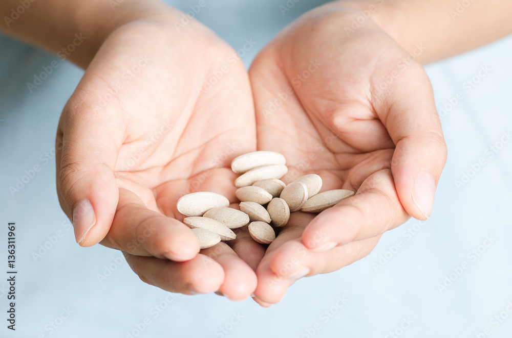 Medicine herb in hand,Alternative Medicine,Herbal supplement pill Medicine herb in hand,Alternative Medicine,Herbal supplement pill