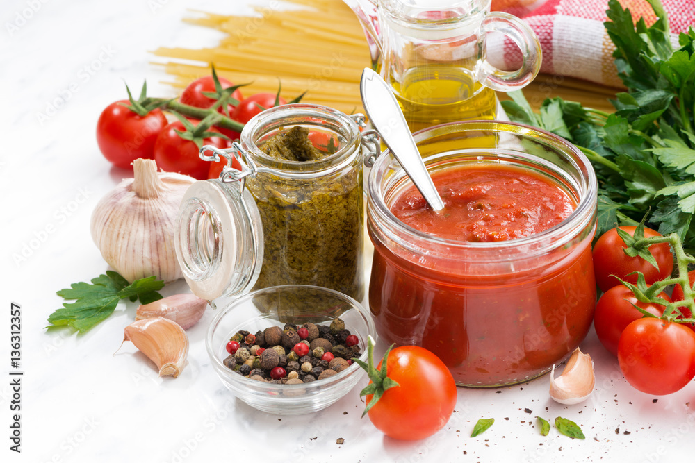 tomato sauce, pesto and ingredients for pasta, closeup tomato sauce, pesto and ingredients for pasta, closeup