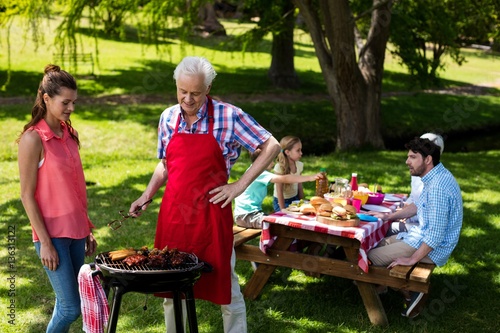 Family preparing barbeque