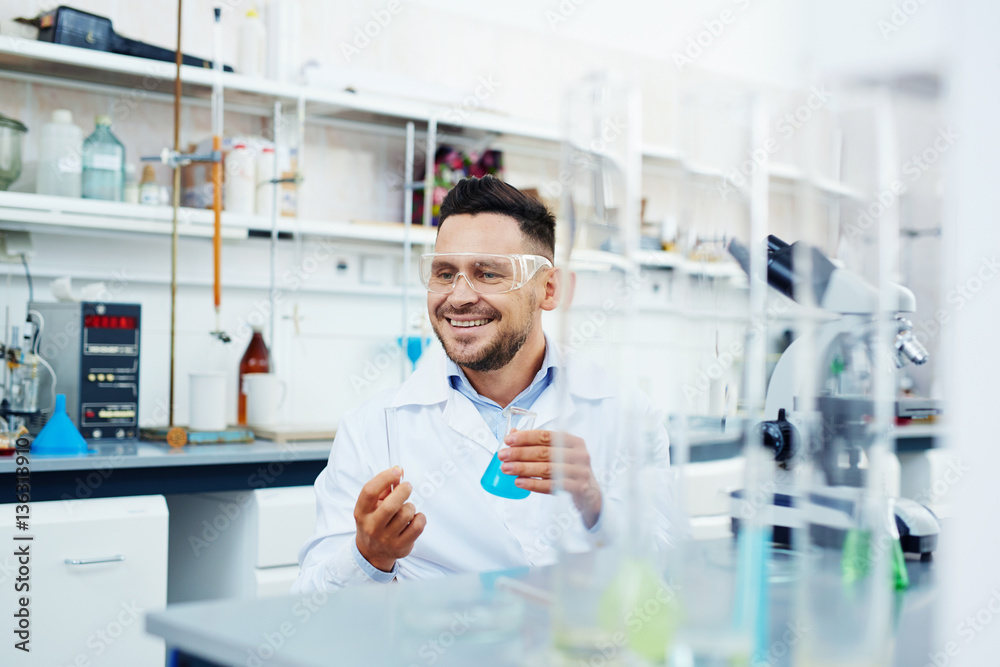 Successful chemist working with new vaccine Successful chemist working with new vaccine