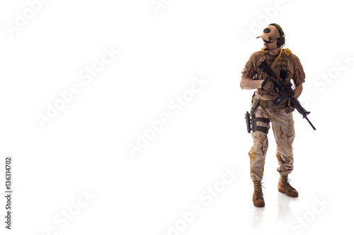 Obraz na plátně man military outfit a mercenary soldier in modern times on a white background in