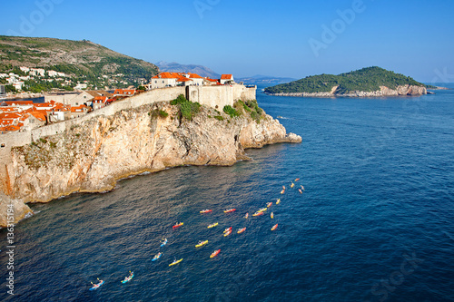 Tourists, kayaking, view at The Old town of  Dubrovnik and Lokrum island from Fort Lovrijenac, Dalmatia, Croatia