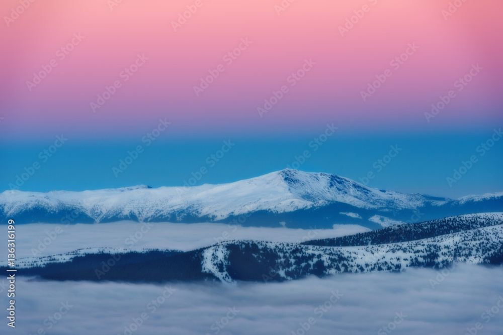 Incredible views of the mountain range winter sunset