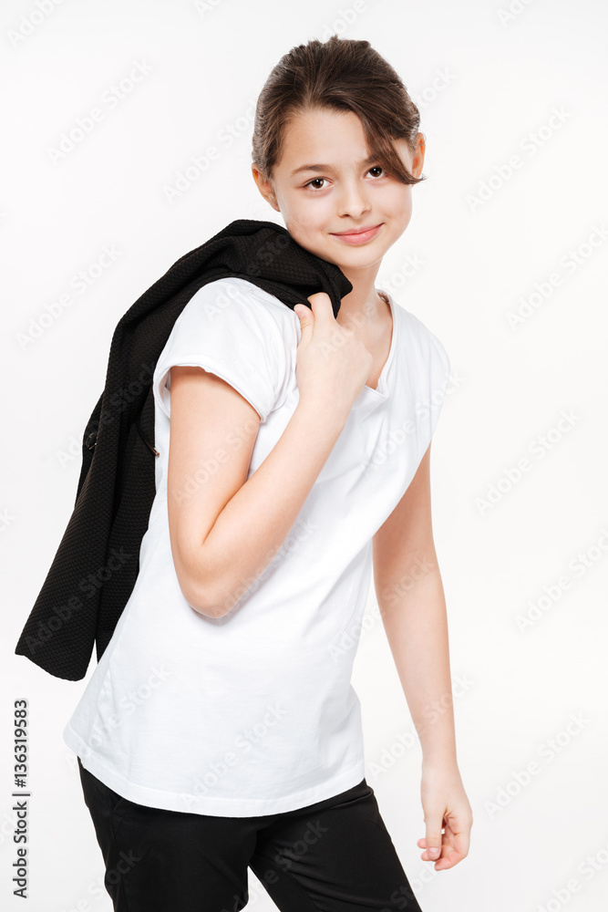 Happy young girl posing isolated over white background. Happy young girl posing isolated over white background.