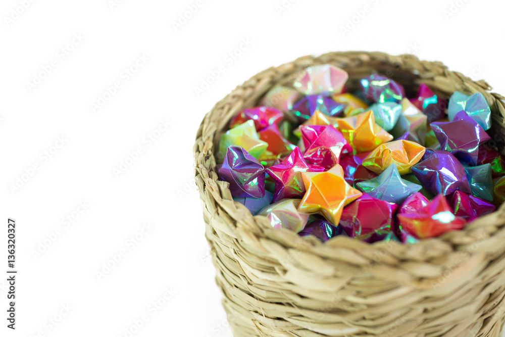 colorful of paper fold christmas stars in the wood basket