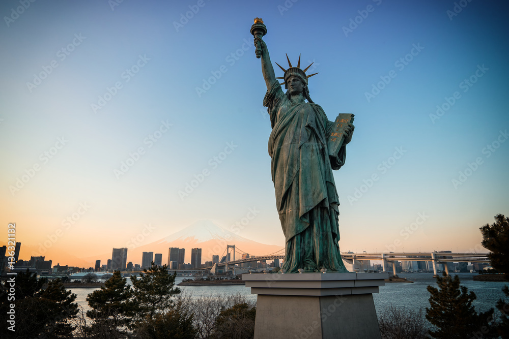 Fototapeta premium scene of Statue of Liberty and rainbow bridge and mount fuji - can use to display or montage on product