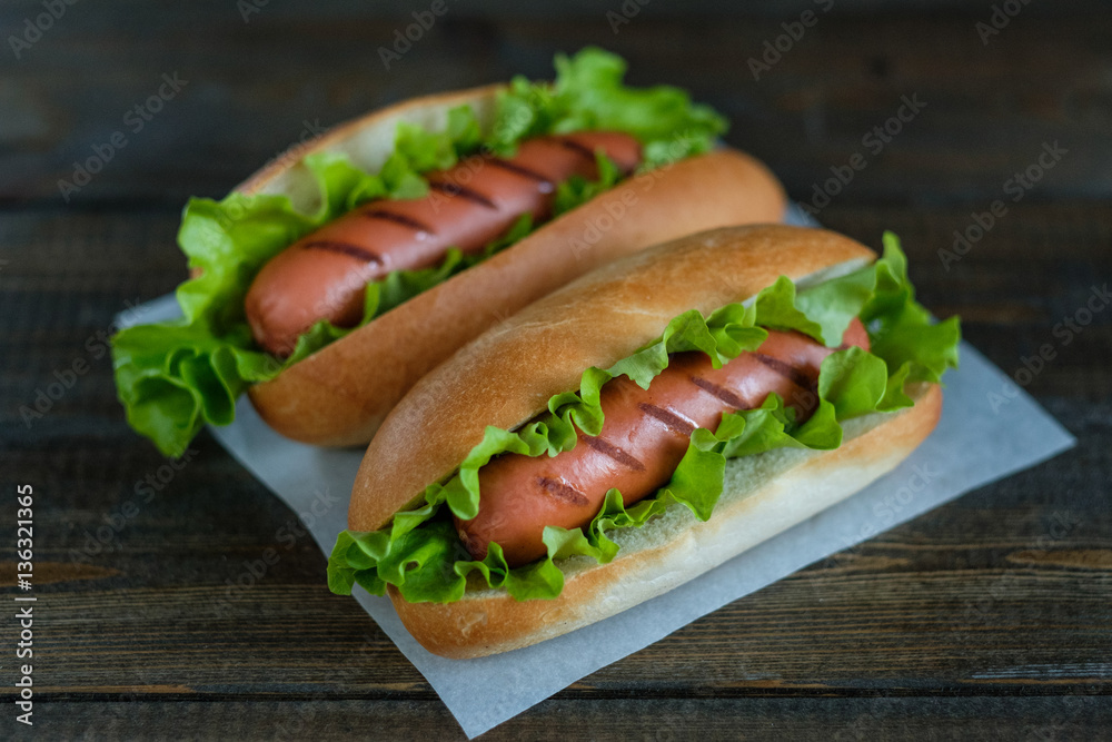Hotdogs on a wooden board. Photo closeup. Hotdogs on a wooden board. Photo closeup.