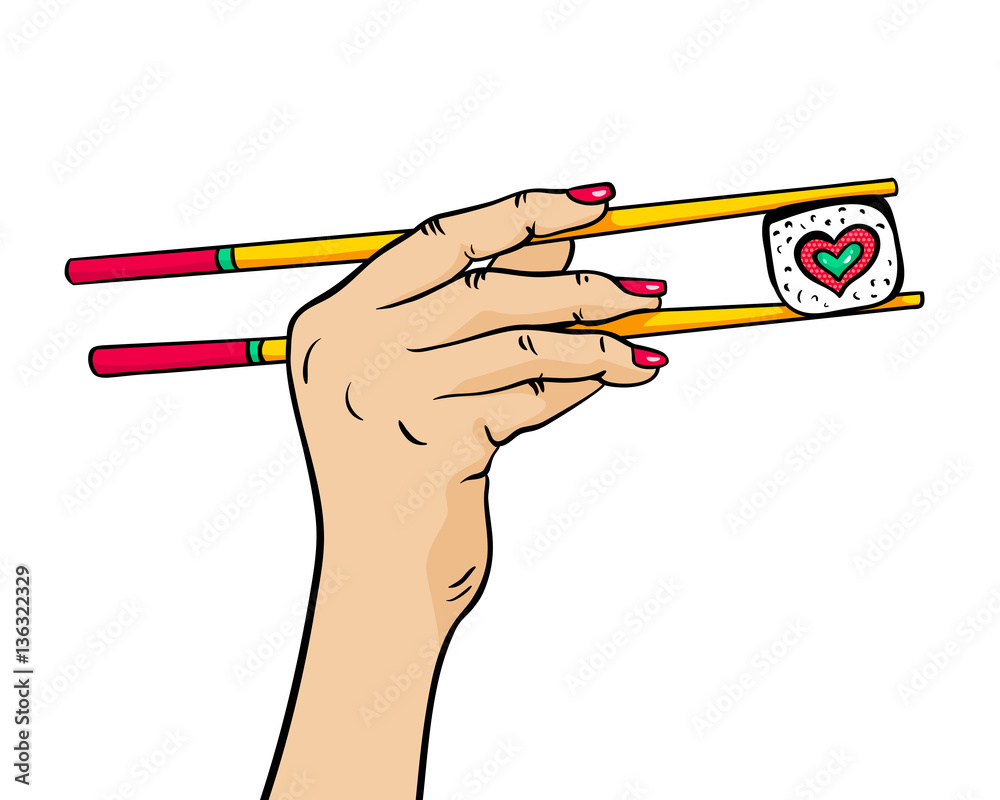 Female hand holding chopsticks with sushi roll in form of heart in her