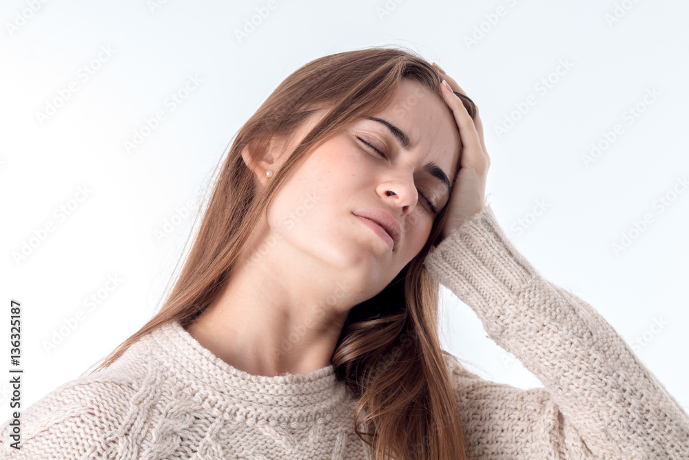young girl holds hand behind his head isolated on white background young girl holds hand behind his head isolated on white background