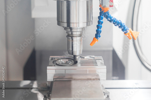 High precision CNC machining center working, operator machining