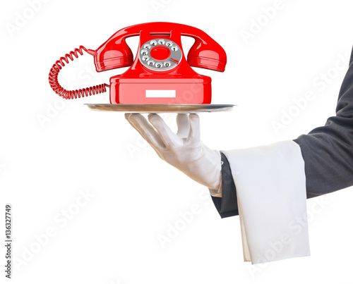 Waiter offering a red old telephone. 3d illustration