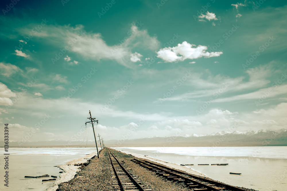 Railway tracks cross over saline desert - obrazy, fototapety, plakaty 