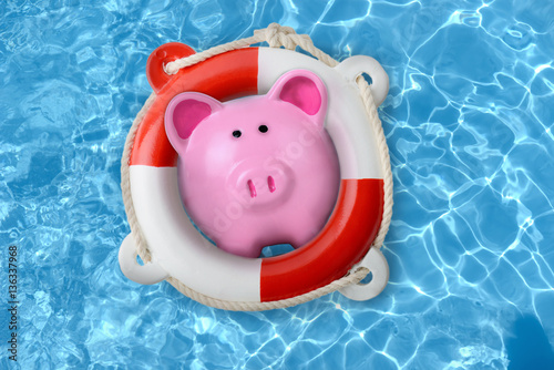Piggy bank in a lifebuoy