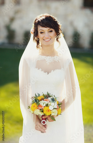 Pretty bride with wedding bouquet