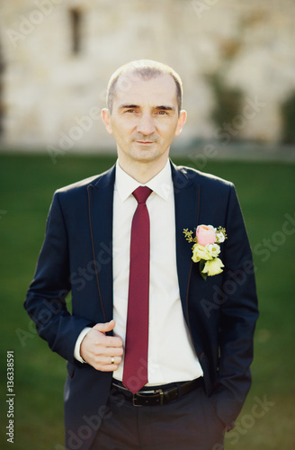 Excited groom waiting outside