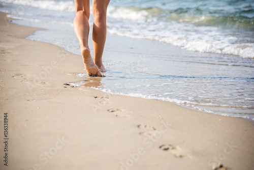 Beach travel - woman walking