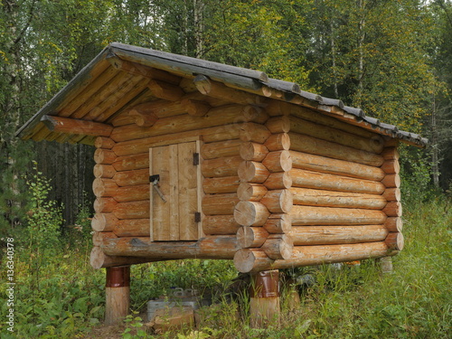 wooden shed at taiga forest