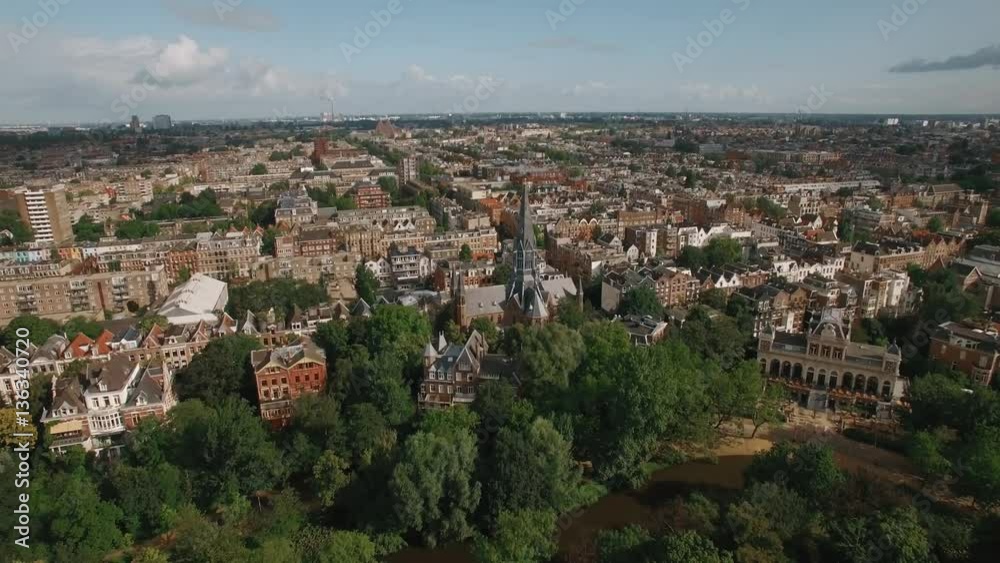 Aerial panorama of Amsterdam with houses, Vondelpark and Vondel Church. Dutch capital