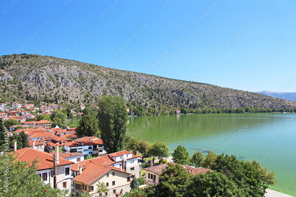 Stone traditional houses and lake Orestiada in Kastoria city  (Epirus, Greece)