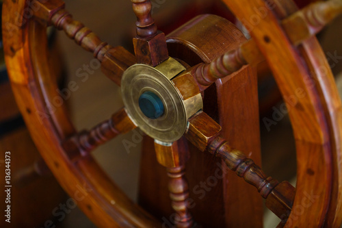 Wooden steering wheel on an old ship