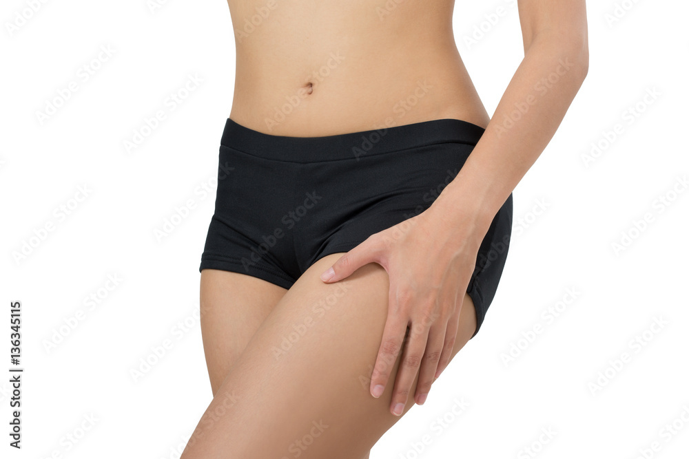 Woman massage her thigh in pain area isolated on white background Woman massage her thigh in pain area isolated on white background