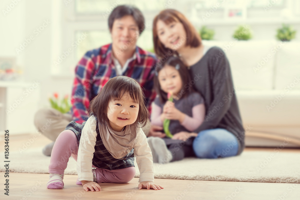 Young happy family with pretty daughters playing and having fun Young happy family with pretty daughters playing and having fun
