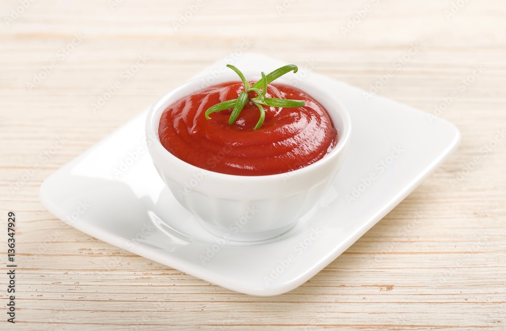 ketchup or tomato sauce on a wooden background ketchup or tomato sauce on a wooden background