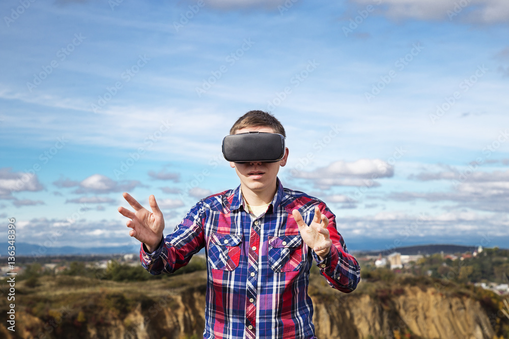 Young man in virtual reality, vr glasses. Young man in virtual reality, vr glasses.