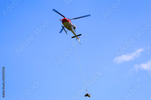Helicopter in Flight on a Blue Sky