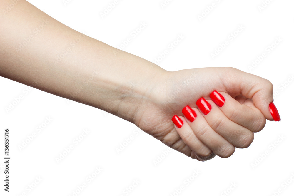 Beautiful female hand with red manicure and nail. woman's fist